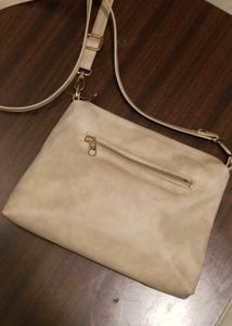 cream colour sling bag
