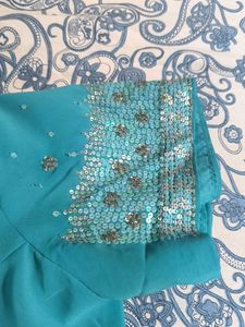 Saree With Stiched Blouse .
