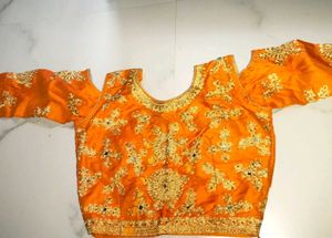 Orange  Blouse With Peacock Green Lehenga