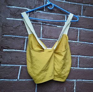 Hardly worn mustard yellow crop top .