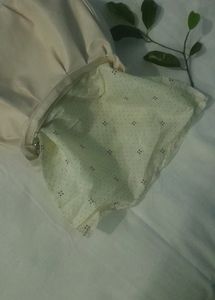 A Beige Side Bag.