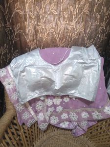 A very beautiful lavender colour saare with jdau work and shimmery padded blouse