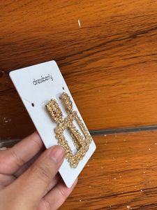 Gold toned textured geometric drop earrings