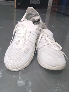 white sneakers.