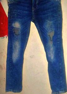 Ripped Blue Denim Jeans