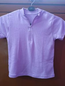 A light purple, body-fitting crop top