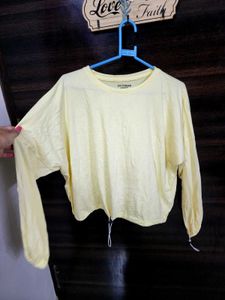 Yellow Long Sleeve Top with elastic at the bottom.