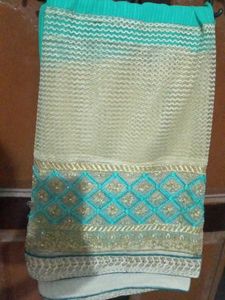 Elegant Turquoise & Gold Saree