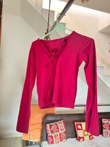 Its A Maroon Colour Crop Top With Long Sleeves