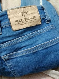 Distressed Denim Jeans With Scratches