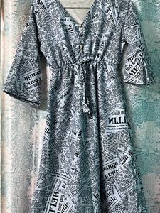 “Chic Newspaper Print Midi Dress with Flared Sleev