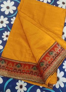 A Light Organe Saree With Red Broad Embroidery