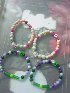 4 BRACELETS TWO PINK 2 GREEN POPULAR ITEMS
