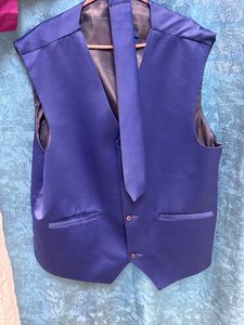 It Is a Blazer With Waist Coat And Tie