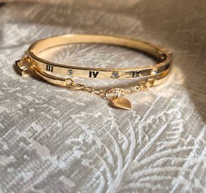 Gold Bangle with Heart Charm