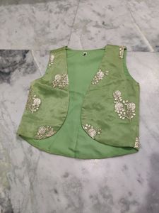 cream gown with mint green jacket