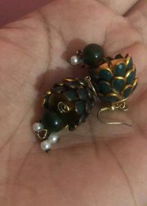 Green earrings Have Some Signs Of Wear And Tear