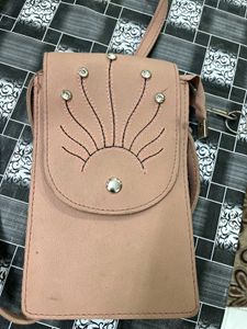 Elegant Pink Sling Bag with Embellished Sunburst