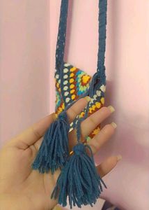 beautiful adjustable crochet sling.