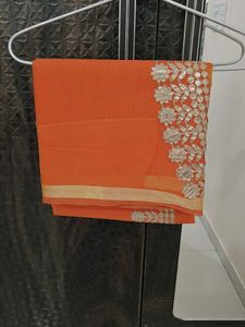 Orange saree with silver embroidery