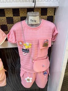 Pink Ribbed Outfit with Floral Accents