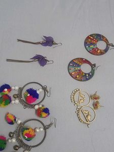 Multiple Pairs Of Earings And One Necklace