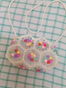 A Sling Bag With Pearls