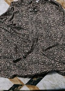 leopard-print top with pearl buttons