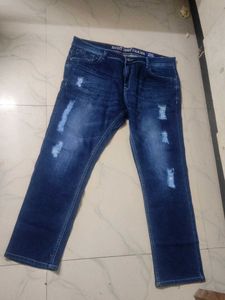 Distressed Blue Denim Jeans