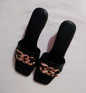 golder and black heels