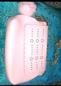 Pink kiss-lock coin purse