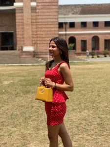 red dress with Polka Dot Handbag both