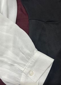 Chic black dress with white sleeves