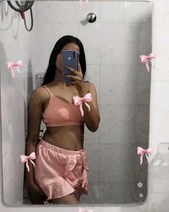 Pretty pastel pink satin shorts with ruffle detail