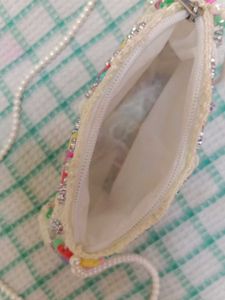A Sling Bag With Pearls