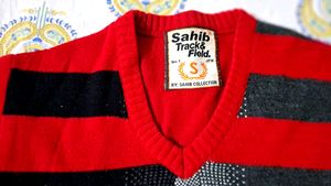 Branded red color sweater for men.