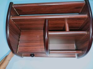 A wooden makeup or pen stand