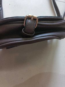 blue and dark brown sling bag