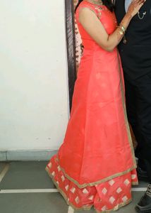 Dark Peach Colour Ethnic Gown. Net Dupatta Availab