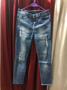 Slim Fit Distressed Denim.