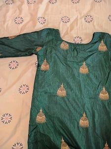 Dark Green Kurta With Golden Jumka Design