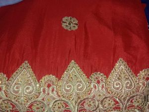 Red Heavy Saree With Golden Blouse.