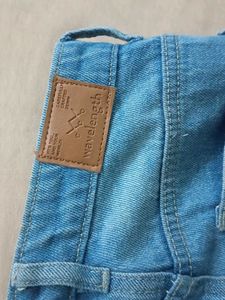 Mid Rise Ripped Denim Jeans