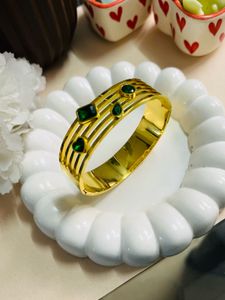 Gold Tone Bangle with Green Accents