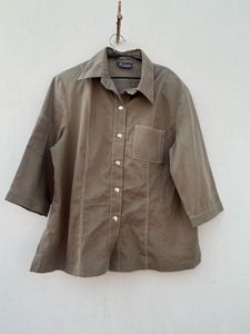 olive green shirt with padded shoulders