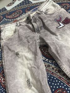 Grease Denim Distressed Jeans
