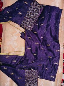 Crossandra saree with purple heavy blouse
