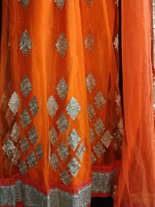 Orange Net Unstitched Lehenga For Women