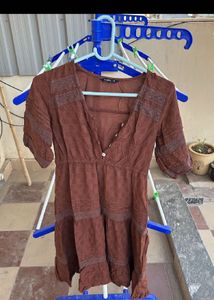 Combo of brown dress and black wide leg jeans