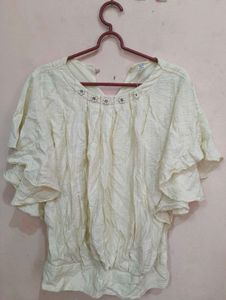 Ruffled Top with Neckline Embellishment
